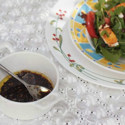 Arugula, tomato and salted egg salad with ginger vingaigrette