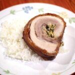 A sliced of roasted pork belly